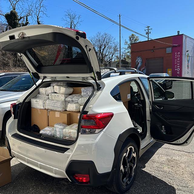 Thousands of diapers and supplies are stuffed into vehicles so Johns Hopkins Medicine can ensure patients have the essentials to care for their families. 